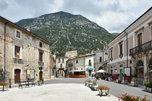 Pacentro, Italy – August 04, 2018: A view of street among the old stone buildings of Pacentro in a background of mountain