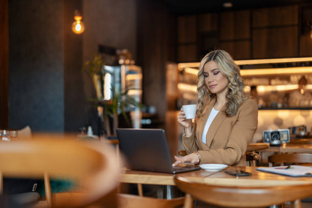 istock Businesswoman is working in cafe 1454869110
