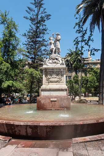 Fountain with stanue and sculpture in honour of Simon de Bolivar, the South American independence leaader, in Plaza de Armas, Santiago de Chile.