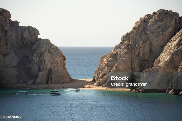 Lovers Beach And Divorce Beach At Cabo San Lucas On The Baja Peninsula On The West Coast Of Mexico Between The Sea Of Cortez And The Pacific Ocean On A Sunny Day With Calm Waters Stock Photo - Download Image Now