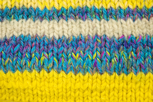 bright striped background, needle knitting, fabric