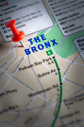 A road map of New York City with The Bronx marked with a pushpin showing road and rail access