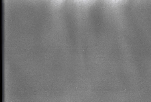 100 Iso Black and White film grain textured background stock photo