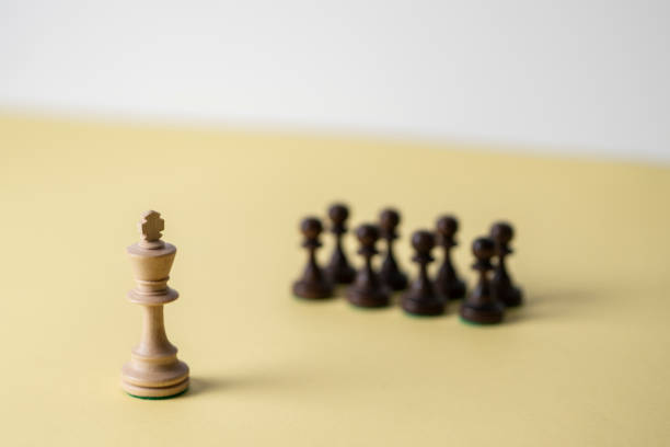 istock king chess piece standing near pawns 1454877269