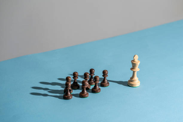 istock king chess piece standing near pawns 1454877272