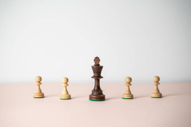 istock king chess piece standing near pawns 1454877273