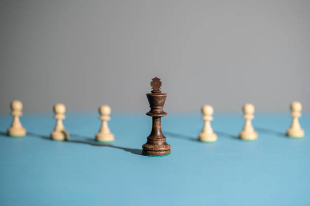 istock king chess piece standing near pawns 1454877287