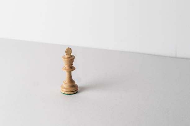 istock single wooden chess king piece, leadership concept 1454877294