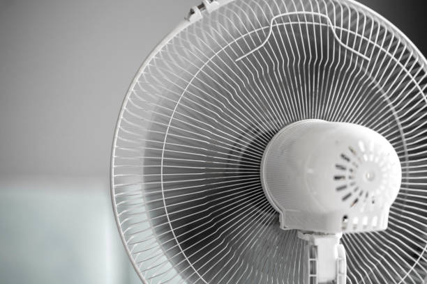 istock a close up isolated white ventilator fan at home 1454878947