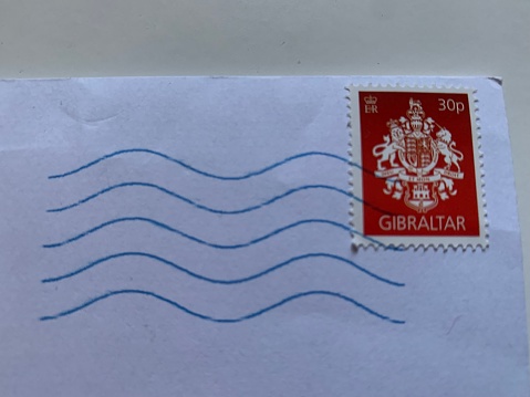 Red 30 pence stamp with postmark