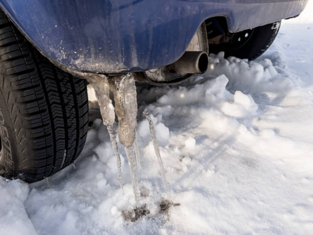 istock Snow under the wheels and icicles on the bumper. 1454880808