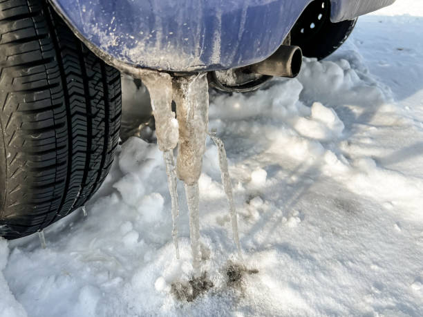 istock Snow under the wheels and icicles on the bumper. 1454880885