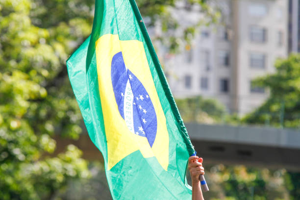 istock Brazilian flag outdoors on a sunny day in Rio de Janeiro. 1454881124