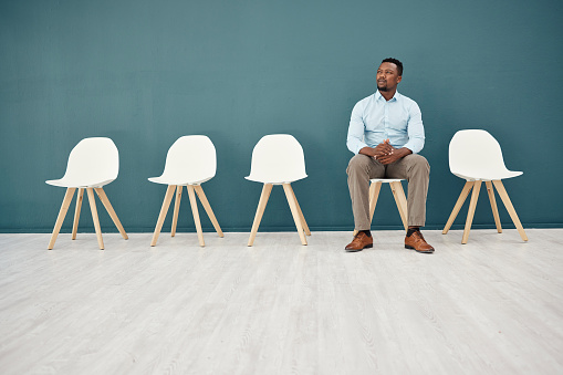 Recruitment, waiting room and business black man thinking of career opportunity, job search hiring and interview for hr mock up, Corporate man, employee or entrepreneur with ideas in Human Resources