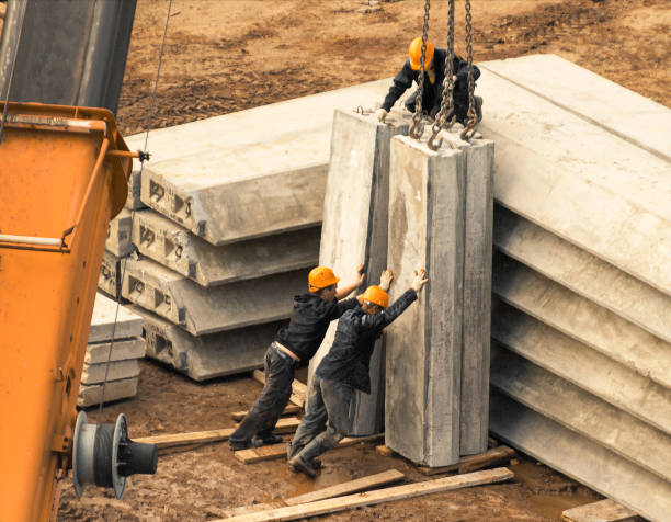 construction builders unload concrete blocks stock photo