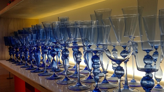 An exhibit of blue glasses displayed at the Wadsworth Atheneum