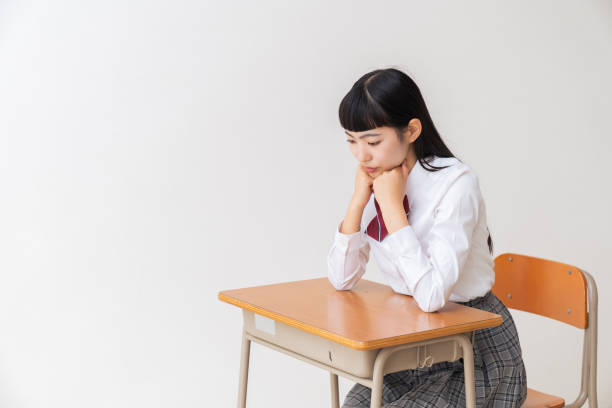 istock girl who study,think,School uniform,School classroom 1454902839
