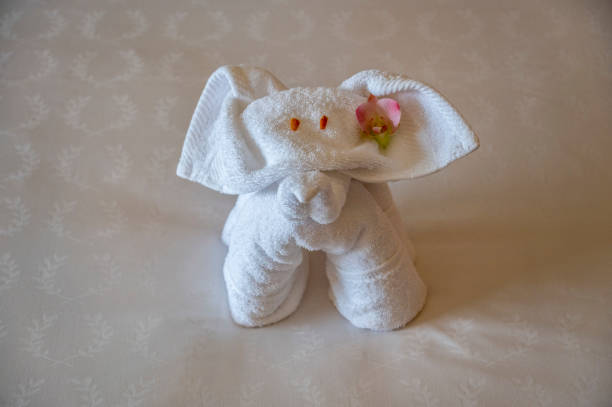 Elephant made of washers in a hotel room, decorating the bed.