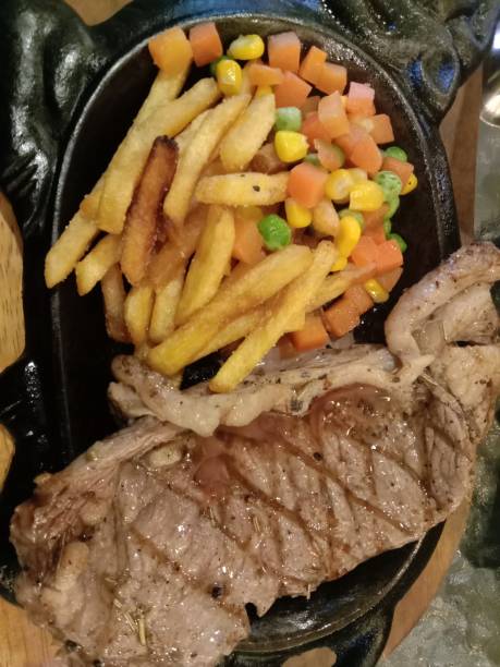 istock Steak with fries and vegetables 1454909130