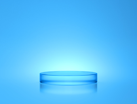Display podium circle cylinder light blue clear glass on glow light bright blue background. crystal stage clean cool bright. product stand or pedestal for beauty cosmetic, skin care. 3D Illustration.