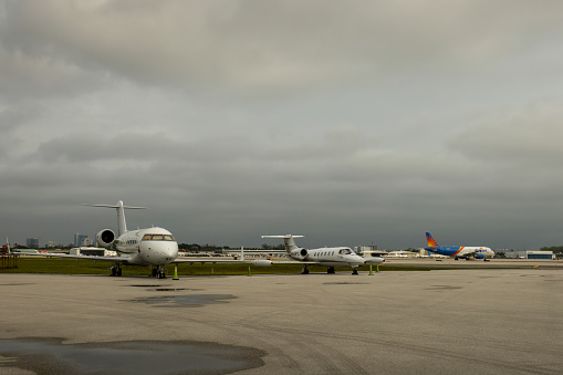 Fort Lauderdale, Florida, USA - December 2022: Private jets on the tarmac at Fort Lauderdale-Hollywood International Airport in Florida, USA