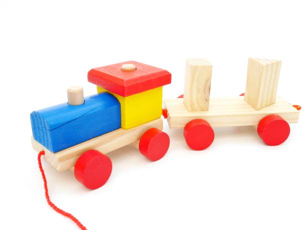 istock Wooden train on isolated white background 1454916964