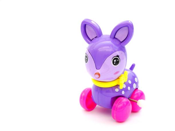 Purple deer wind up toy on isolated white background with copy space