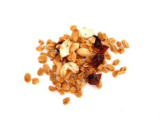 istock Pile of granola cereal on isolated white background 1454919291