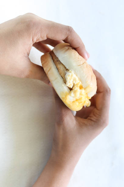 istock women hand holding beef burger top view 1454921161