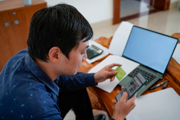 istock Businessmen are using laptops and smartphones 1454921199