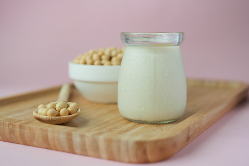 soy milk pouring in a glass jar