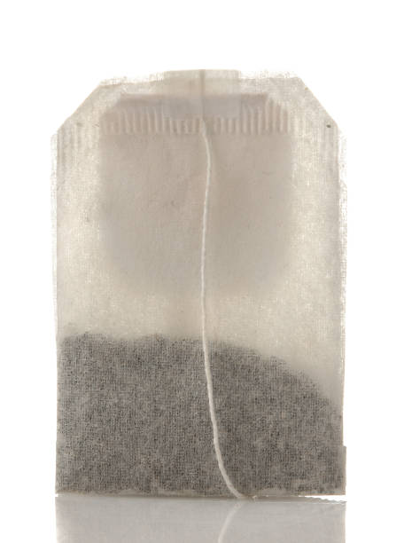 istock tea bag closeup on white isolated background. tea. to make tea 1454927689