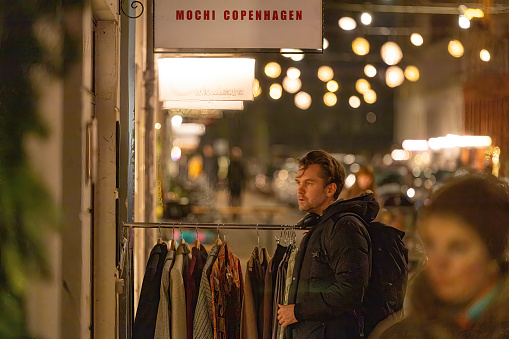 Copenhagen, Denmark Dec 22, 2022 Window shoppers on Jagersborggade in Norrebro.