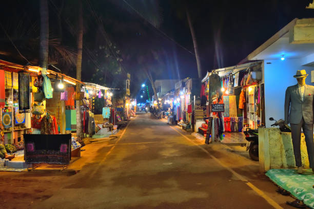 istock Streets at night in Agonda, Goa illuminated by different shops. 1454928127