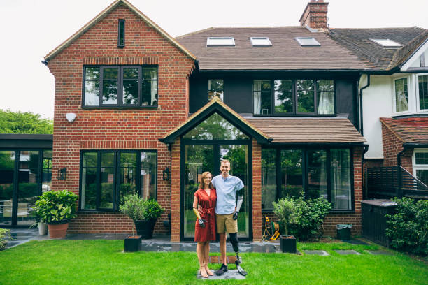 istock Young couple and modern two-storey brick house 1454928932