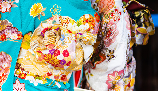 Close up details of colorful Kimono worn by young women on \