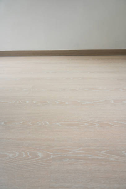 istock wooden floor and white wall, construction industry 1454932375