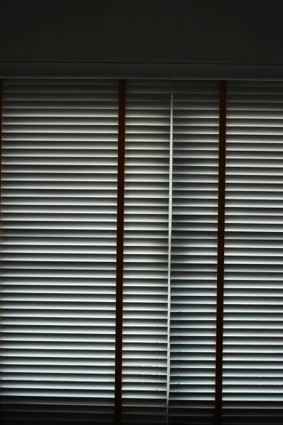 istock white blinds curtain put on the window, interior design 1454932468