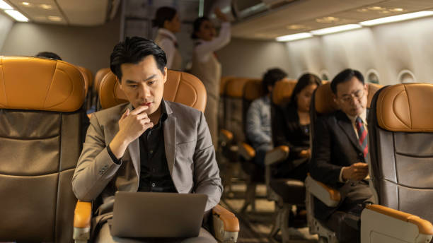 istock Passengers in an airplane cabin 1454935586