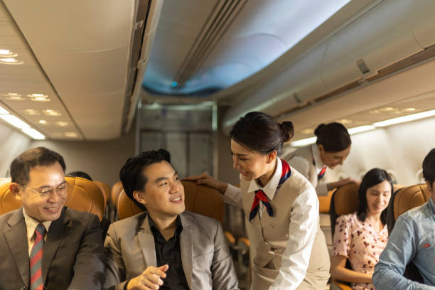 istock Passengers in an airplane cabin 1454935600
