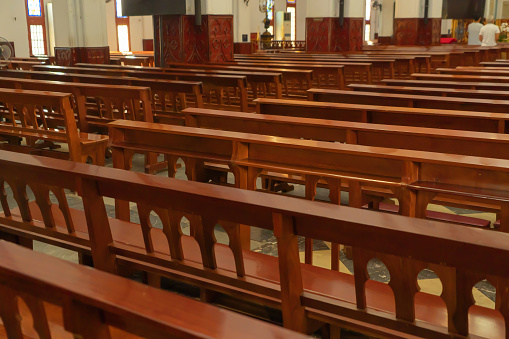 Interior of empty christian church with cross, architecture design. Religious beliefs. Catholic religion. Jesus worship.
