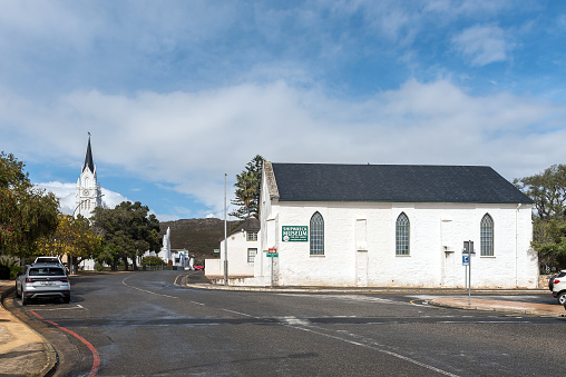 Bredasdorp, South Africa - Sep 23, 2022: A street scene, with the Shipwreck Museum and the Dutch Reformed Church, in Bredasdorp in the Western Cape Province