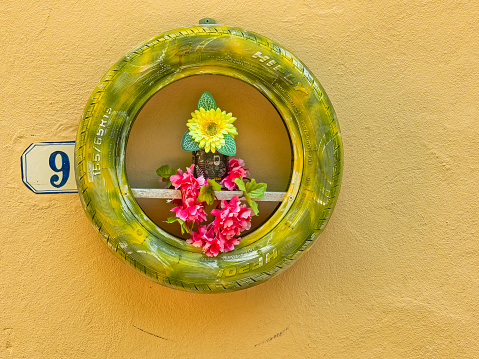 The Tuscan region in Italy on May  18, 2022:   Funky flower box seen along the streets of Tuscany Italy