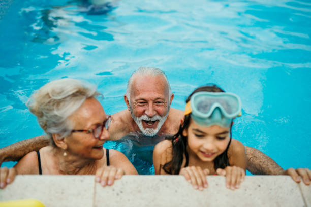 istock A family having fun in the swimming pool 1454946458