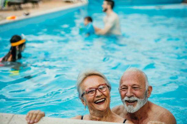 istock Senior couple in the pool 1454946459