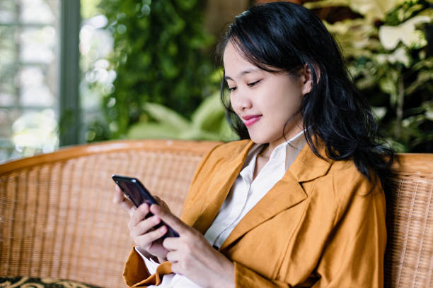 istock Adult Woman Interacting With Digital Devices 1454950480