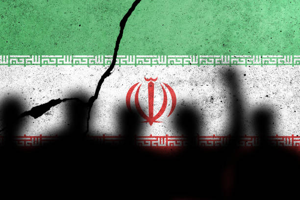 istock Flags of Iran painted on the concrete wall with protesting people 1454952507