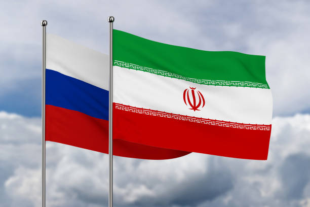 istock Iranian and Russian flag on sky background. 3D illustration 1454952586