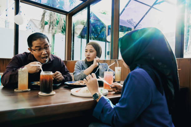 istock asian employees taking lunch in the restaurant 1454952933