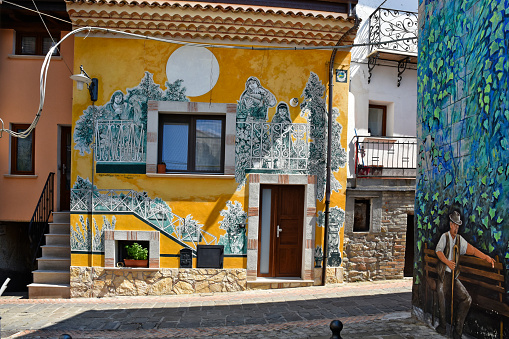 Satriano di Lucania, Italy – August 24, 2019: Mural paintings on a house in Satriano di Lucania, a village in the Basilicata region of Italy.